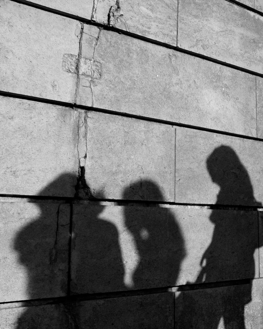 Shadows on a stone wall