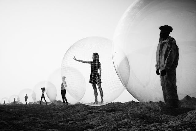 Image of people standing inside zorb balls