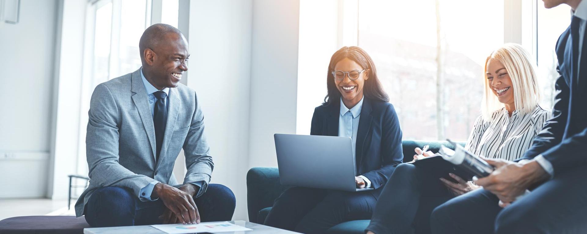 Young professionals in conversation at work