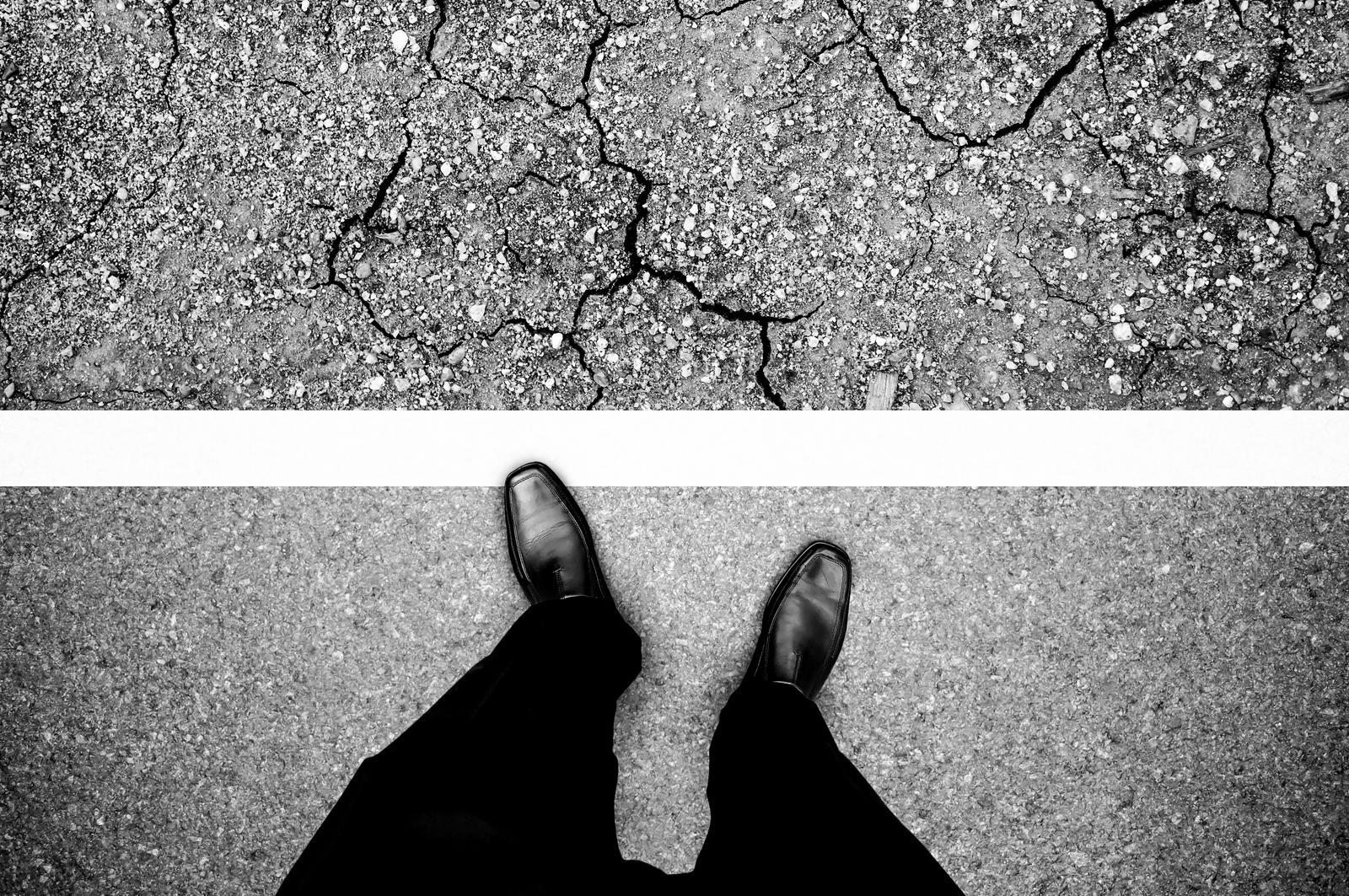 person standing at side of road