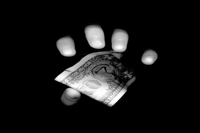 Hand holding money