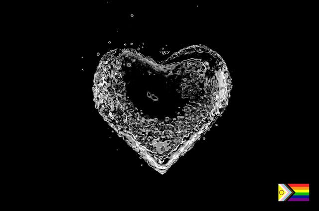 white heart made out of water on a black background