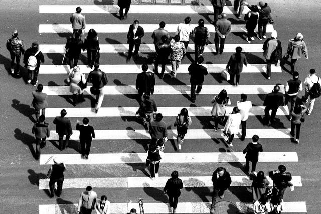 Aerial view of people on busy pedestrian crossing, Shanghai, China