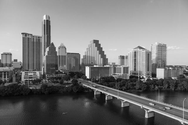 Texas skyline including Congress Avenue bridge over Ladybird Lake, Austin.