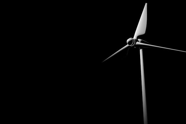 3d render concept of a wind turbine cut out on a black background